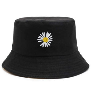 Reversible cotton fisherman hat with small daisy embroidery in black and white minimalist style