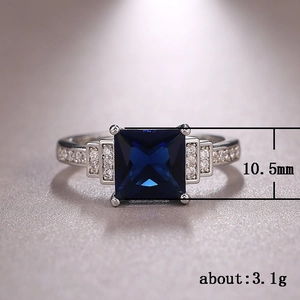 Deep blue princess cut zircon ring in 10.5mm silver-plated band with side diamonds