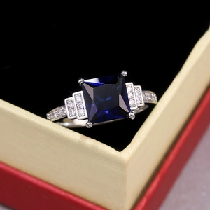 Fashion women ring featuring deep blue square zircon stone and silver-tone diamond setting