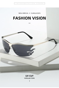 Close-up of silver flame-shaped sunglasses with grey lenses on a white pedestal