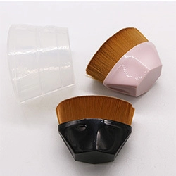 Detail of pink and black diamond handle makeup brushes with clear protective sleeves