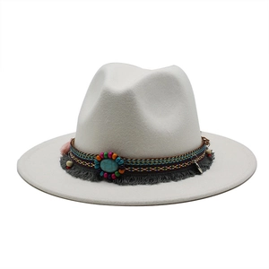 Close-up of white wool fedora with ethnic beaded band and turquoise stone detail