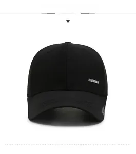 Detail view of the black cotton baseball cap showing the SPORT metal plate logo on the side