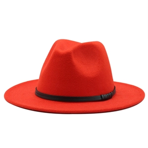 Classic red wide brim fedora hat with black decorative band and wool-like felt texture
