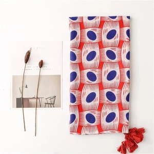 Lightweight cotton-linen scarf with red blue oval patterns and fringe tassels