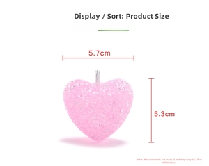 Detail of pink heart-shaped LED ornament with textured surface and top metal loop