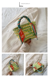 Detail of a yellow checkered woven bag with decorative silk scarf and sun pattern