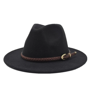 Detail of black wool fedora hat featuring a brown braided leather band and gold buckle