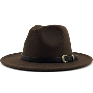 Detailed view of dark brown fedora hat with black leather band and vintage bronze buckle