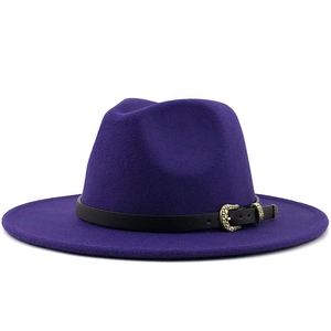 Detail of dark purple wool fedora hat featuring a black leather band and gold buckle