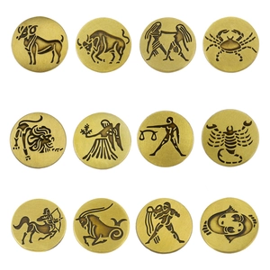 Macro view of 12 zodiac constellation brooches in antique bronze metal finish