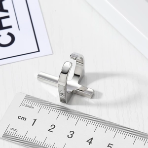Men's punk cross open ring in silver finish with adjustable size on scale background