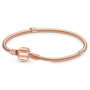 Elegant rose gold snake chain bracelet with classic barrel clasp on white background