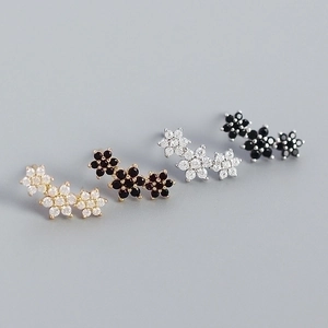 Detailed comparison of s925 floral earrings in gold and silver with zircon inlays
