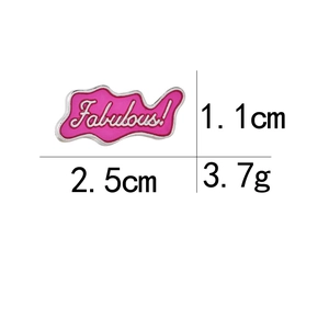 Detail showing pink enamel 'Fabulous!' brooch dimensions with 2.5cm width and 1.1cm height