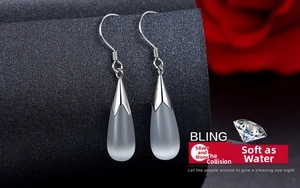 Macro shot of S925 sterling silver waterdrop earrings featuring frosted moonstone stones