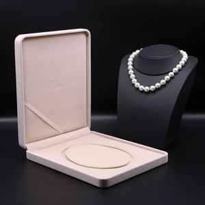 Elegant beige velvet pearl necklace jewelry box with a classic soft interior display