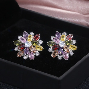 Detailed close-up of luxurious sunflower stud earrings with colorful zircon gemstones