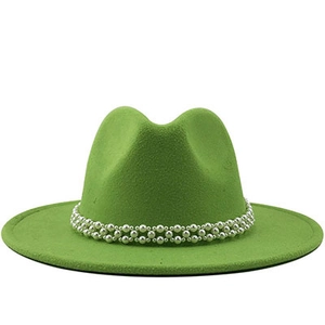 Detail of emerald green wool fedora with double-row pearl band on white background