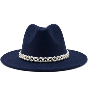Detailed shot of dark blue wool fedora hat featuring three-row pearl decorative band