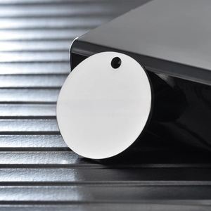 Macro view of blank round stainless steel dog tag for DIY engraving and jewelry making