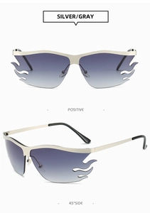 Macro detail of silver flame sunglasses with gray gradient lenses and punk metal frame