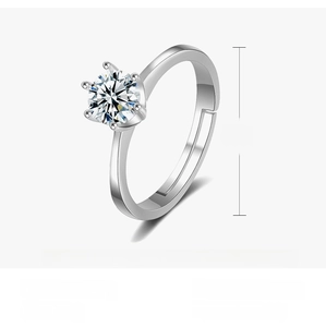Detail of classic six-prong zircon crown ring showing adjustable copper band and 2g weight