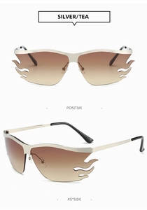 Detail view of flame-shaped silver sunglasses with tea gradient lenses and metal frames