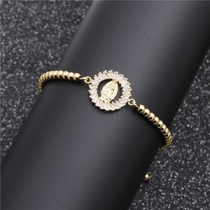 Golden micro-paved zircon bracelet with Our Lady of Guadalupe charm and polished beads