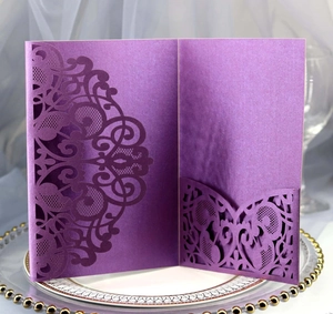 Detail of laser-cut lace pattern on elegant purple pearlescent paper invitation card