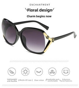 Detail of polarized sunglasses with golden metal hinges and black camellia flower decor