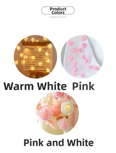 Detailed close-up of LED rose flower fairy lights in warm white and pink for wedding decor