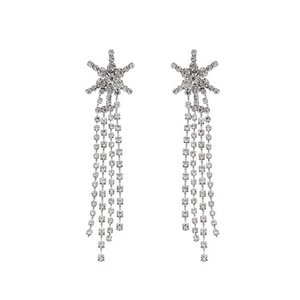 Detailed view of silver snowflake earrings with long cascading rhinestone tassels