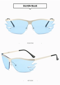 Detailed macro view of silver metal flame sunglasses with vibrant blue lenses