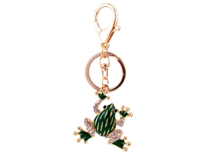 Macro detail of green crystal-encrusted frog keychain with gold-plated metal finish