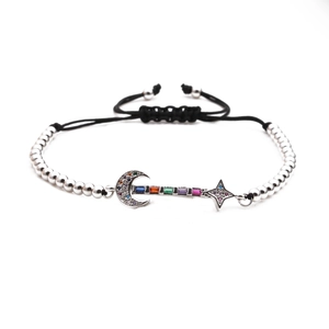 Adjustable silver moon and star beaded bracelet with multicolored zirconia stones