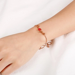 Rose gold heartbeat bracelet with red heart pendant and adjustable drawstring chain