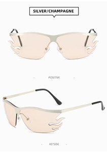 Macro detail of silver flame-shaped sunglasses with translucent champagne lenses