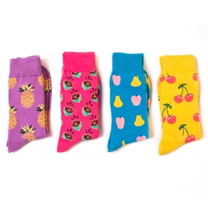 Flat lay of colorful cotton socks with vibrant pineapple lime apple and cherry patterns
