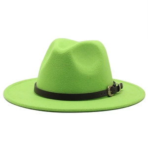 Close-up of emerald green wool fedora hat featuring a vintage gold buckle and leather band