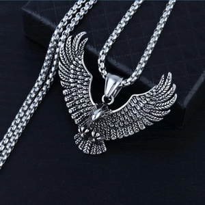 Vintage stainless steel eagle pendant necklace with detailed eagle wings on a box chain