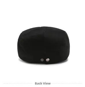 Back view of a black flat cap showing twill cotton texture and silver metal snap detail