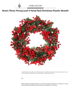 Detail of Christmas wreath featuring red fabric flowers, green leaves and berry clusters
