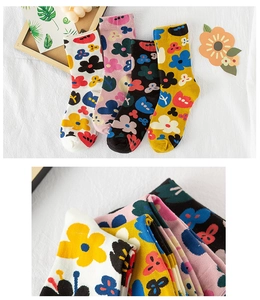 Close-up of four pairs of cotton socks with vintage floral patterns in multiple colors