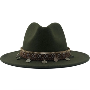 Close-up of bohemian fedora hat featuring ethnic embroidery and metallic coin charms