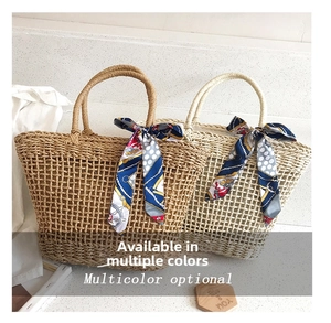 Detail of hand-woven straw tote bags with decorative patterned silk scarves on handles