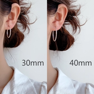 S925 sterling silver hoop earrings in 30mm and 40mm sizes shown on a model
