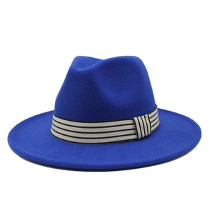 Close-up of royal blue wool jazz hat with a classic black and white striped ribbon band