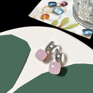 Detail of pink square-cut crystal earrings with micro-pave silver-tone settings