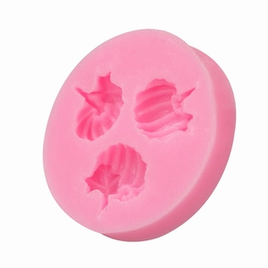 Pink round silicone mold featuring three distinct seashell shapes for DIY cake baking and DIY